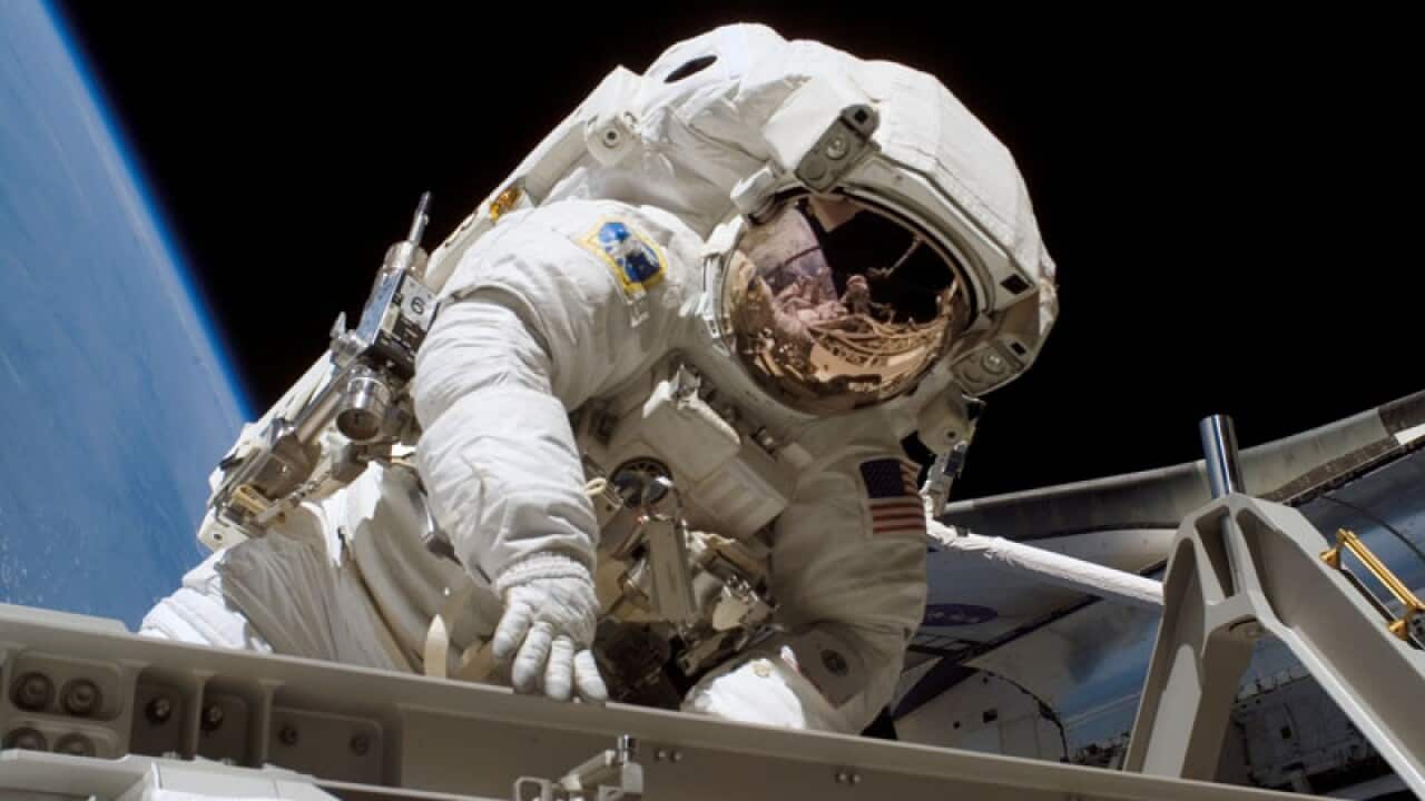 American astronaut Heidemarie M. Stefanyshyn-Piper in an extravehicular activity (EVA) session around September 2003 (AP/NASA).