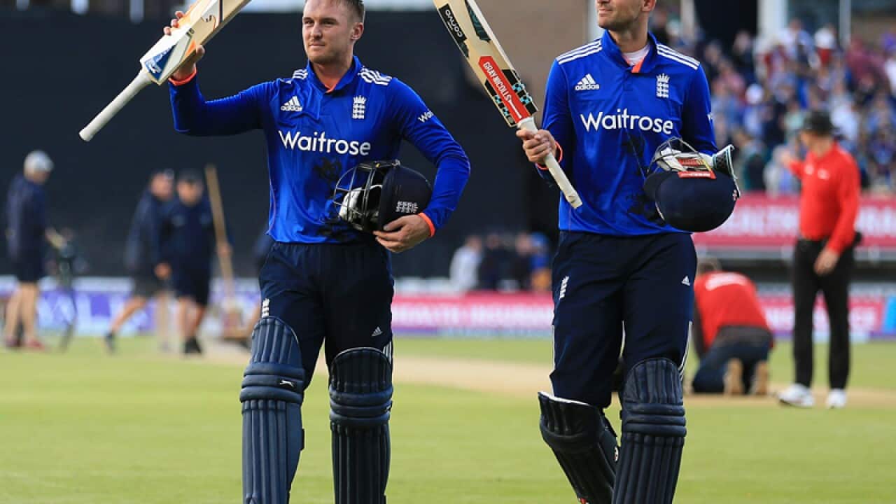 England's Jason Roy (L) and Alex Hales celebrate
