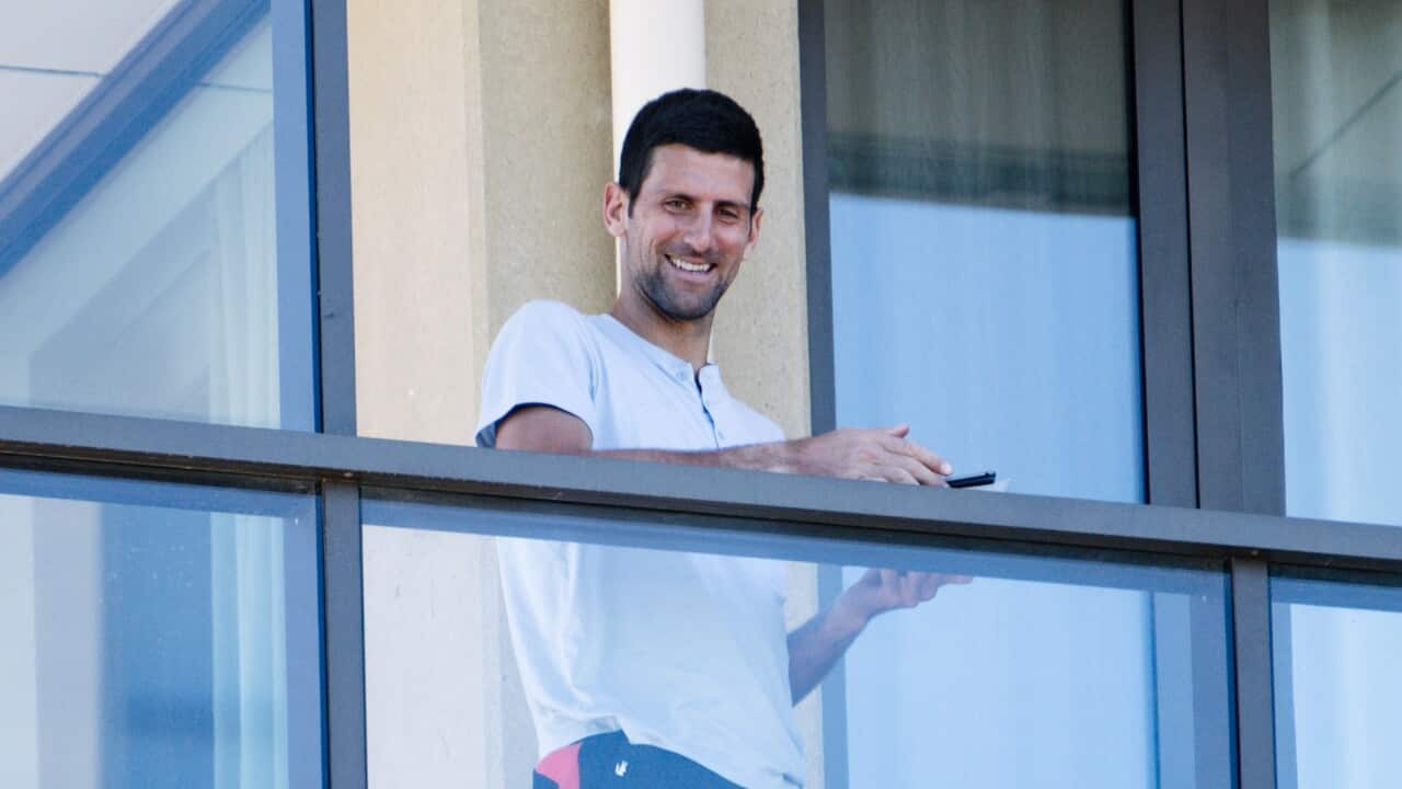 Novak Djokovic on the balcony at The M Suites accommodation in North Adelaide.