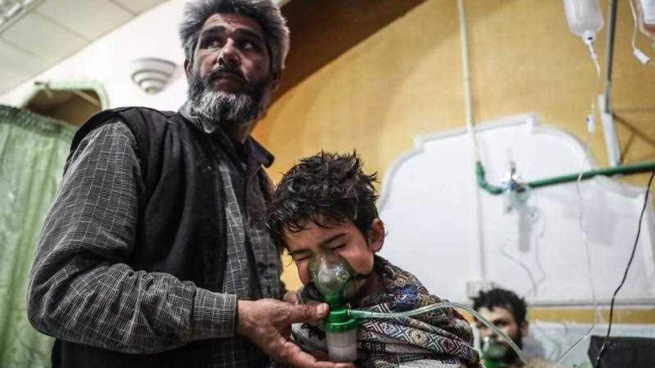 An affected child receives treatment after a gas attack on al-Shifunieh village, in Eastern Ghouta, Syria, 25 February 2018 (issued 26 February 2018).