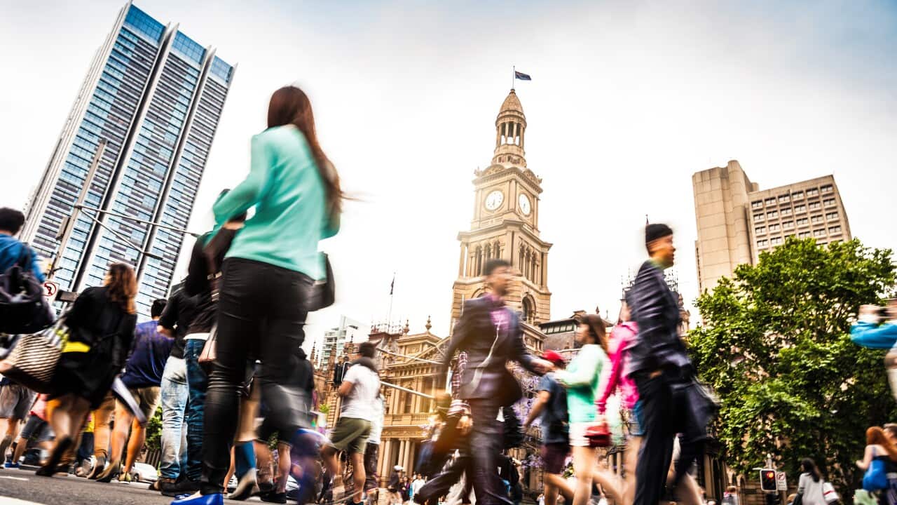 Sydney downtown, blurred intersection people and traffic