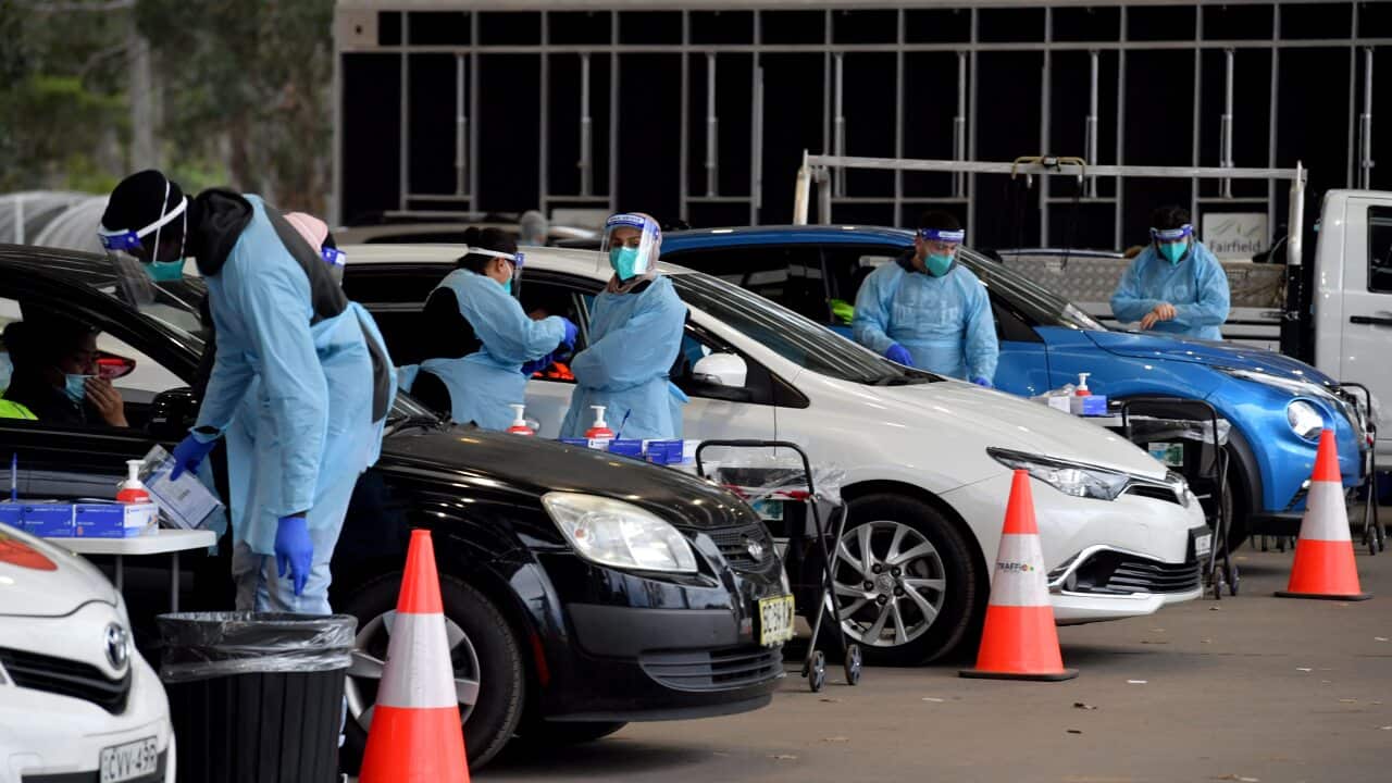 Members of the public and health workers at a pop up COVID testing clinic at the Fairfield Showgrounds in Sydney.