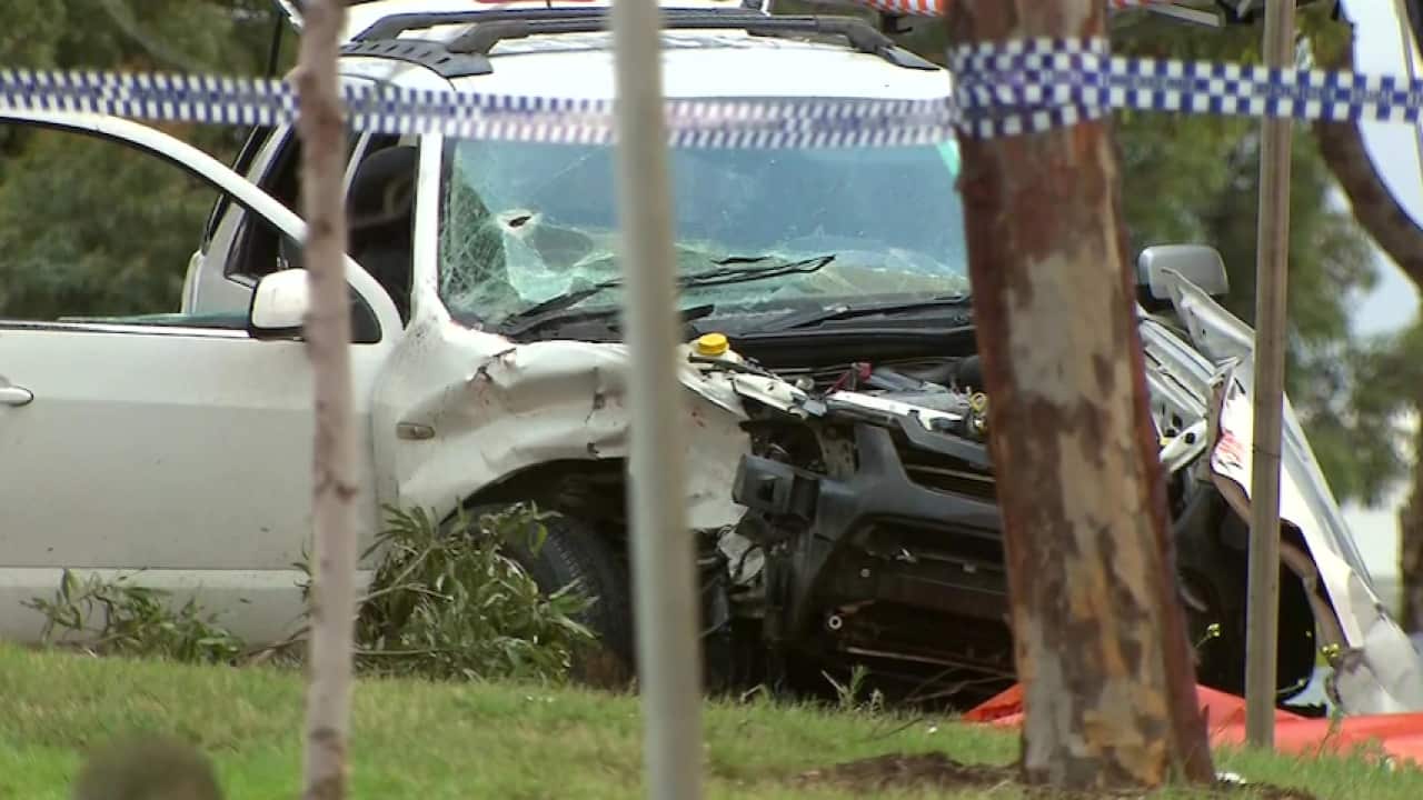 Detectives inspected the damaged car found at the scene.