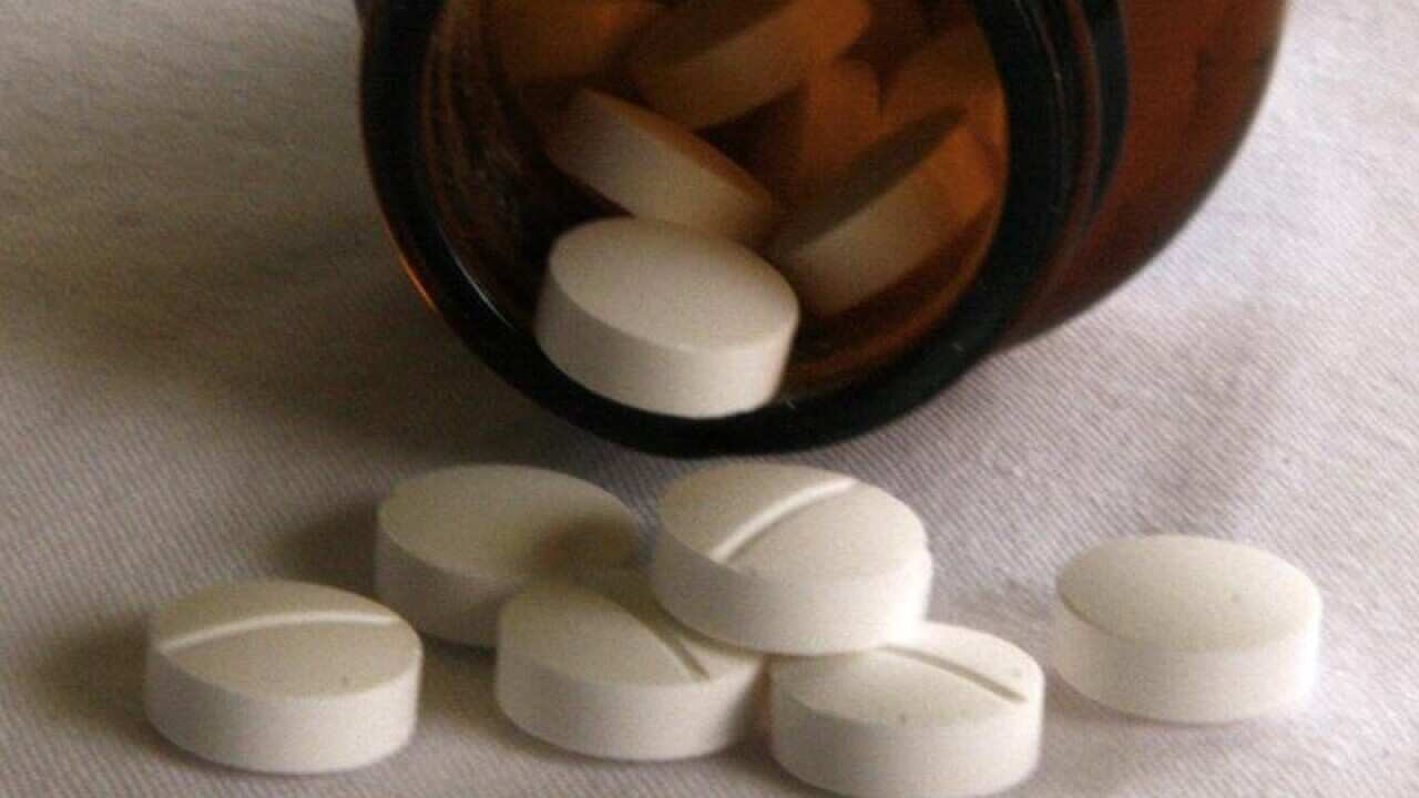 Tablets fall from a jar