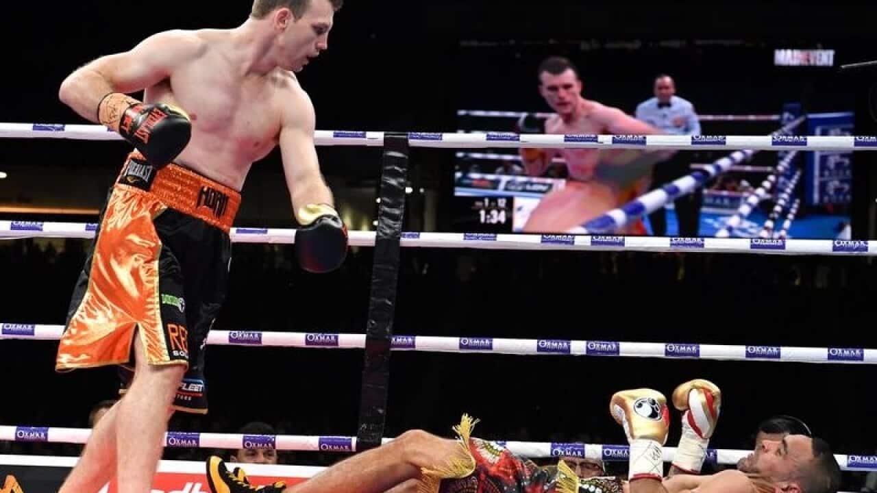 Boxer Jeff Horn (L) knocks out Anthony Mundine
