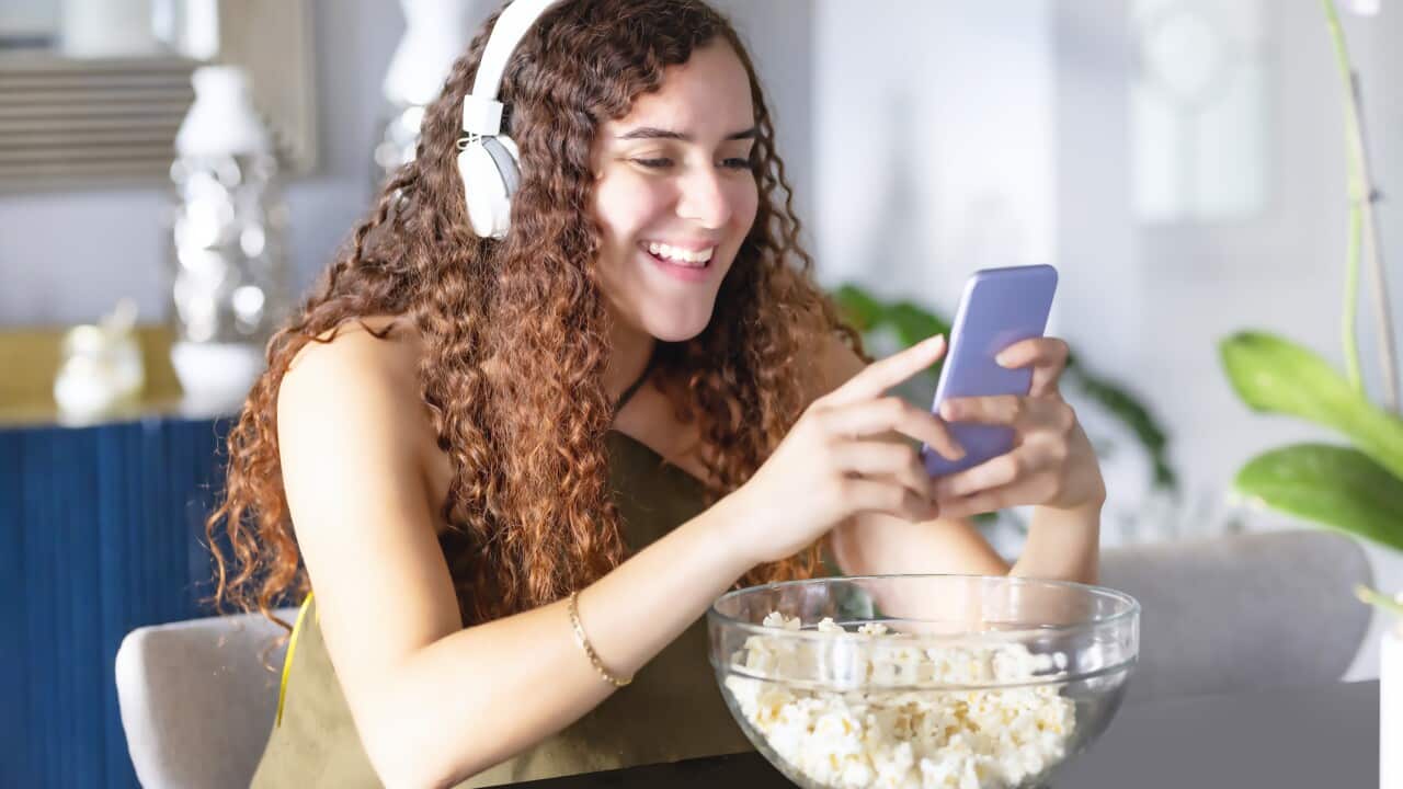 watching videos and listening with headphones
