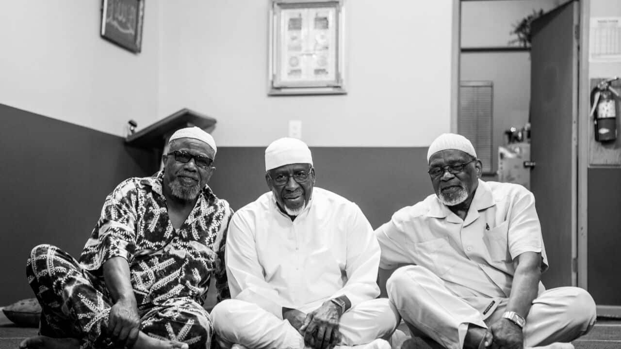 (Centre) Muhammad Najieb, imam at the Muslim Community Center of Portland.