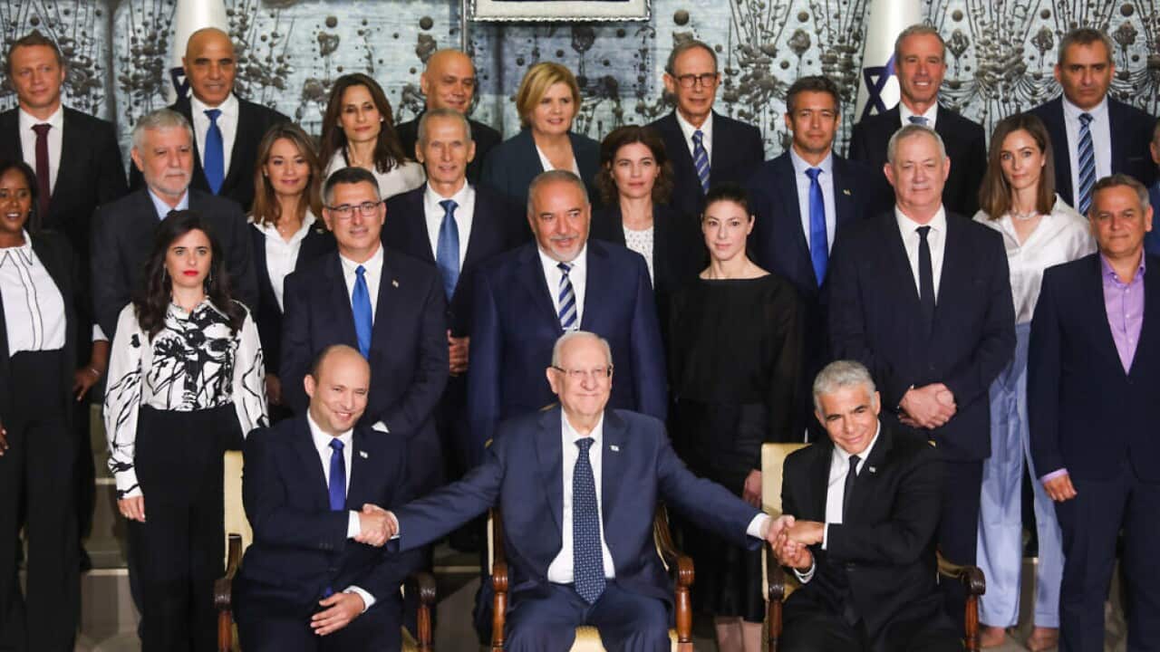 The newly sworn in Israeli government pose for a group photo at the president's residence in Jerusalem on June 14, 2021. Photo by Yonatan Sindel/Flash90 *** Local Caption *** ממשלת שינויבית הנשיאתמונה קבוצתיתריבלין