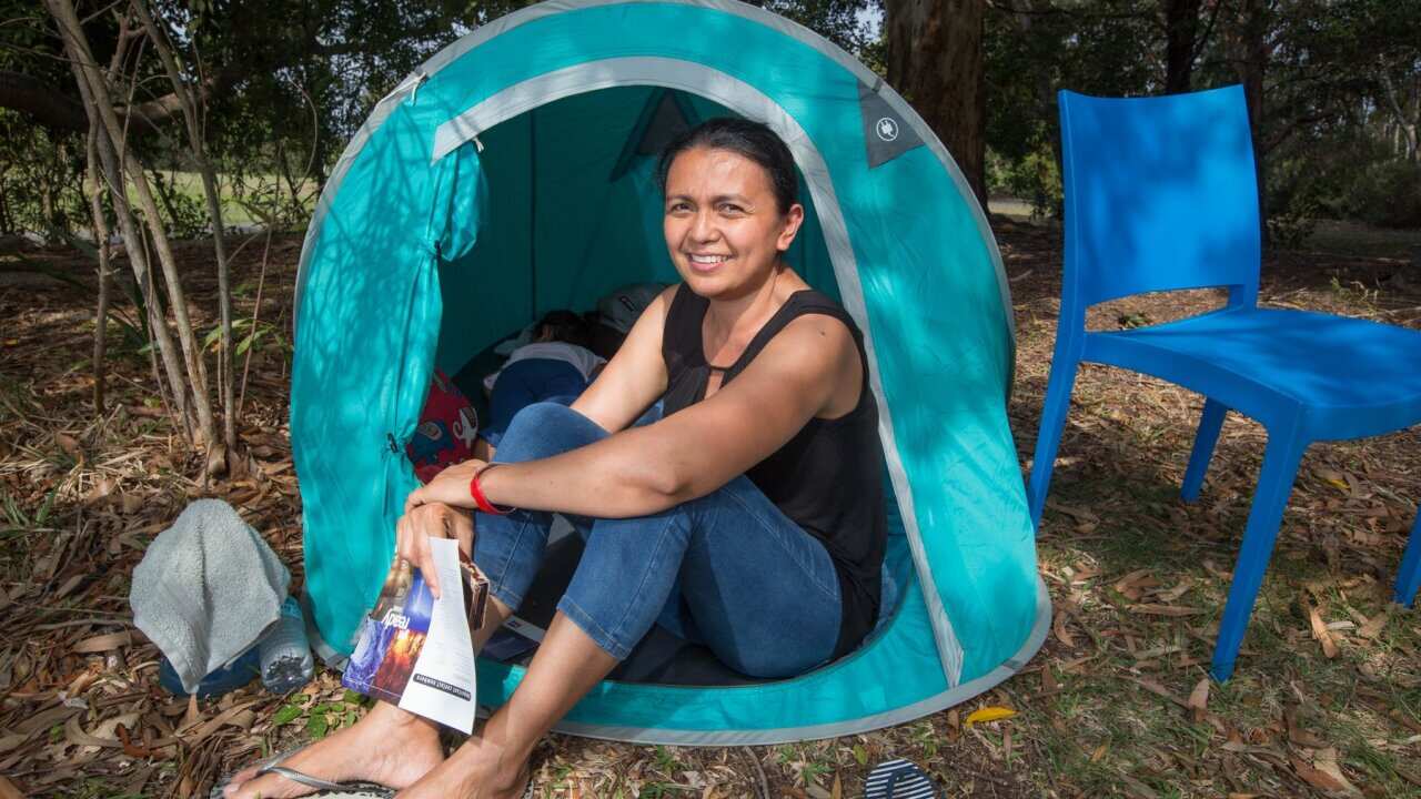 Reyna Lucas and her children Maxine and Jaden were evacuated from their home at Tewantin and are now camping out at the Noosa Leisure Centre.