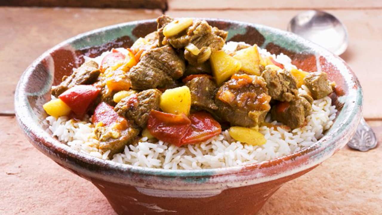 StockFood_00910625---Lamb-Curry-on-a-bed-of-rice.png