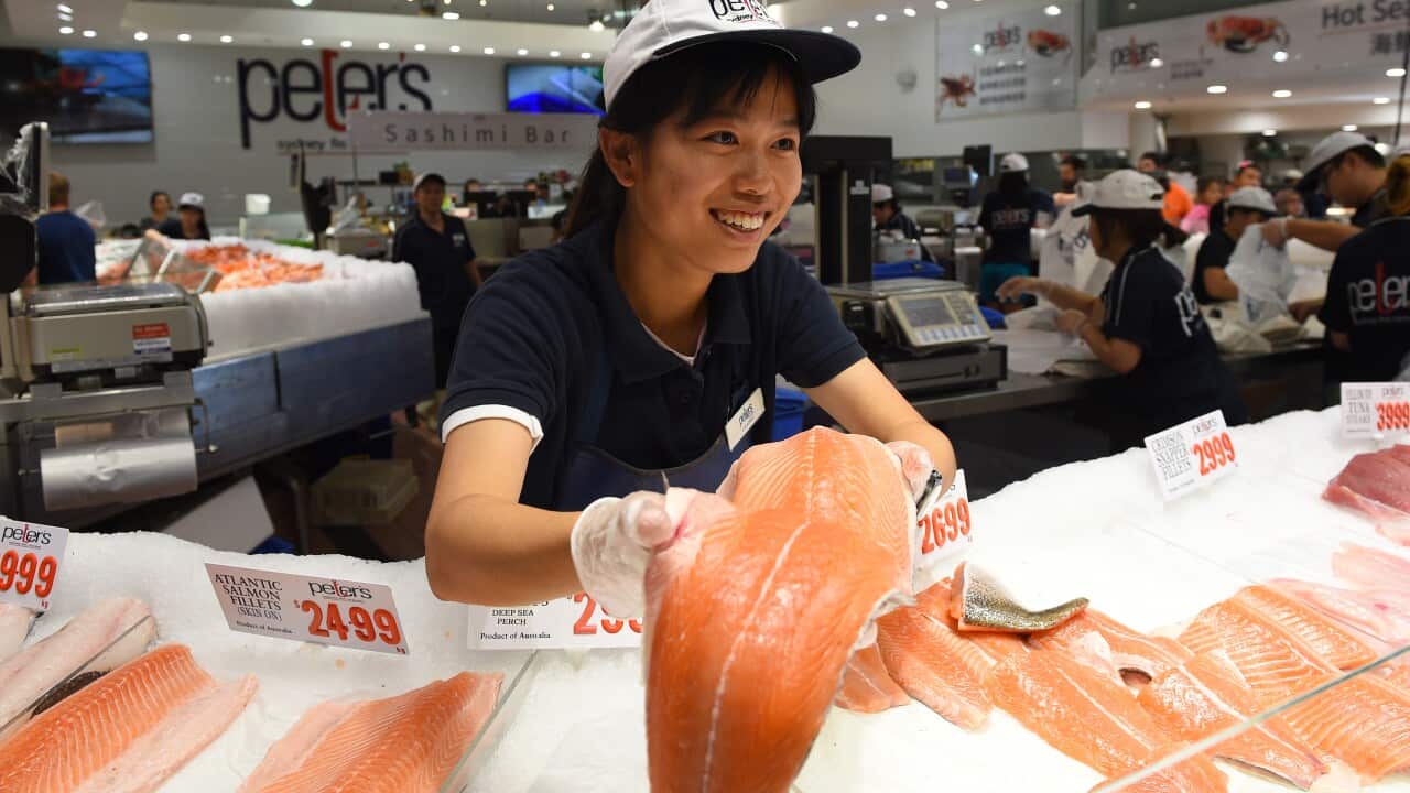 Customers are seen purchasing seafood ahead of Good Friday and the Easter long weekend, at the Sydney Fish Market, in Sydney, Thursday, March 24, 2016.(AAP Image/Dan Himbrechts) NO ARCHIVING