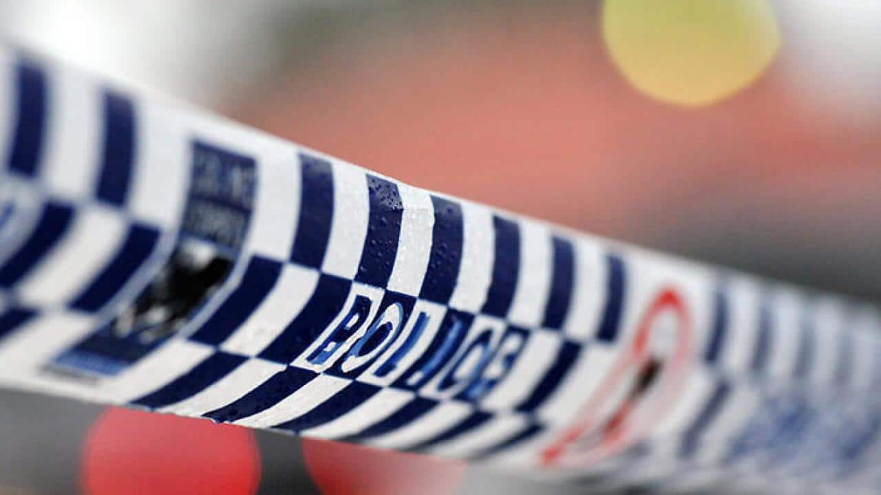 Police tape restricts access to a crime scene