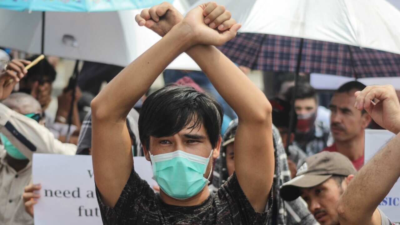 Hundreds of immigrants from various countries rallied by holding up posters in front of the International Organization for Migration (IOM) office in Graha Pena Building in Riau, Pekanbaru, Riau, Thursday August 8, 2019.