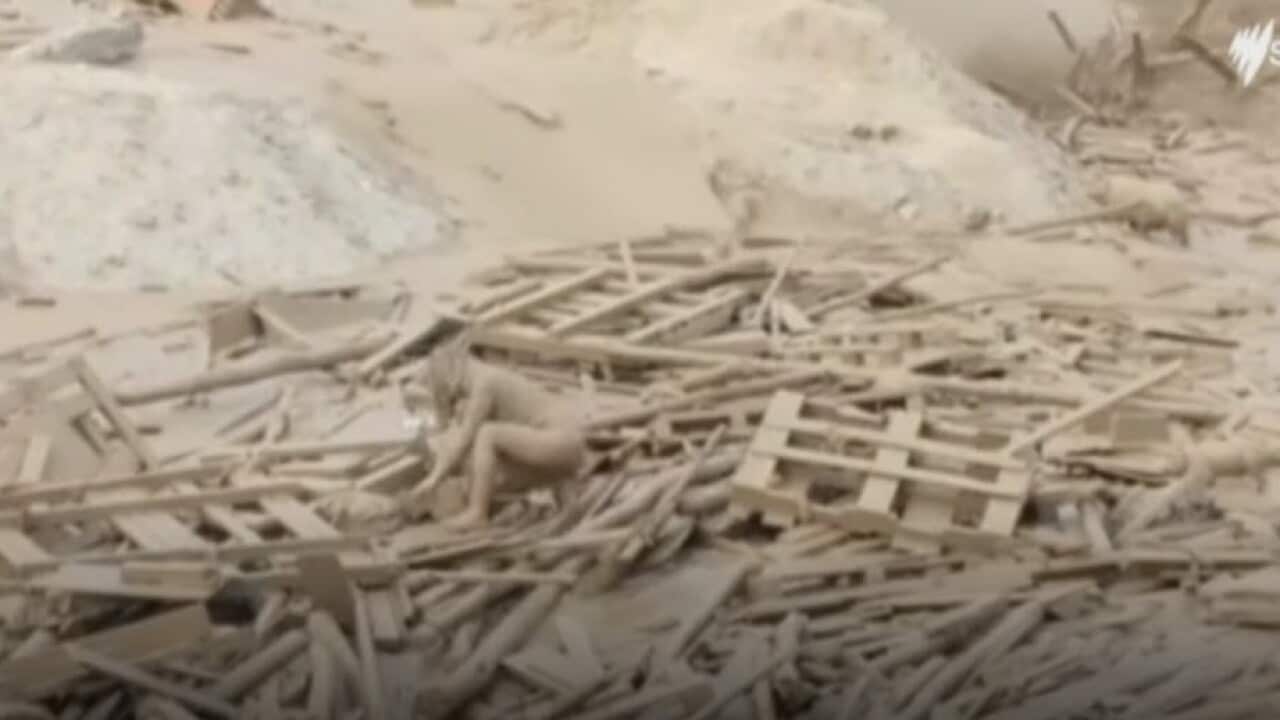 A woman escapes a fast-moving mudslide in Peru.