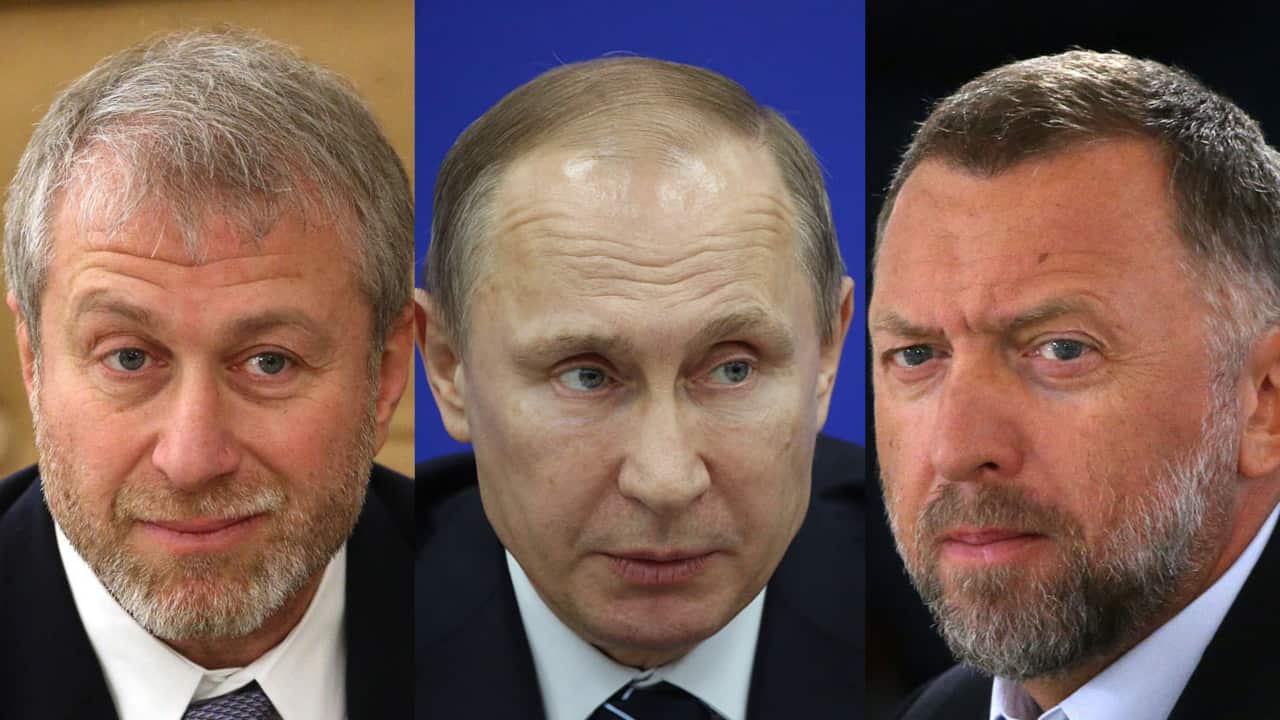 Chelsea Football Club owner and Russian oligarch Roman Abramovich (left), Russia's President Vladimir Putin and Oleg Deripaska (right).