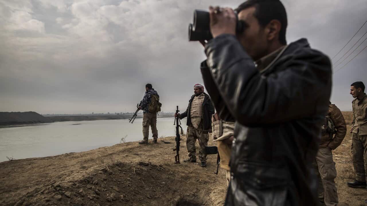Members of the Sunna militia watch for Islamic State militants movement near the Tigris river in Haji Ali village, around 70Km from Mosul, Iraq, Thursday, Dec. 8, 2016.(AP Photo/Manu Brabo)