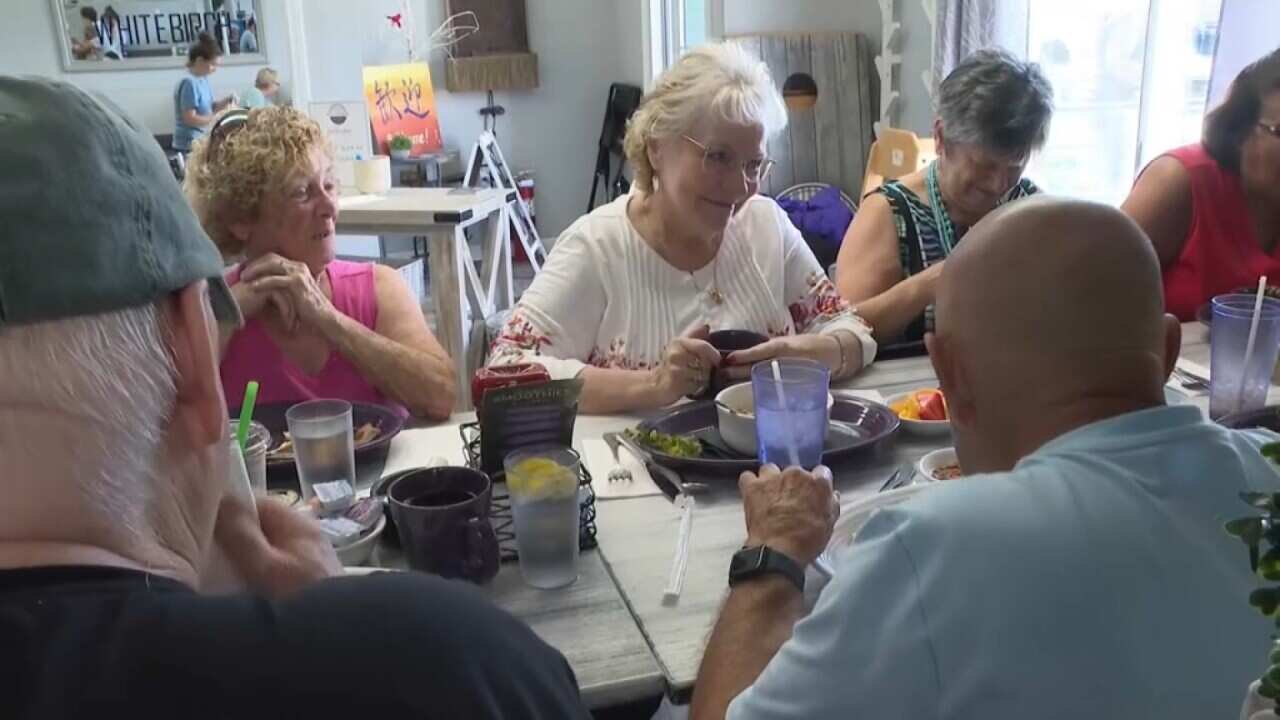 People enjoying a communal meal in the United States as part of Dine out Program. Sept 3 2023 AP.jpg