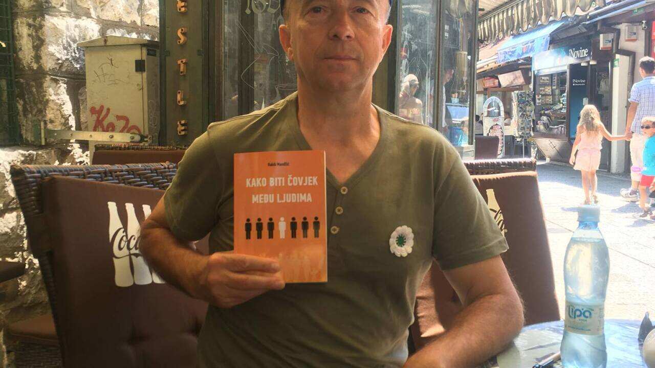 Author with his book