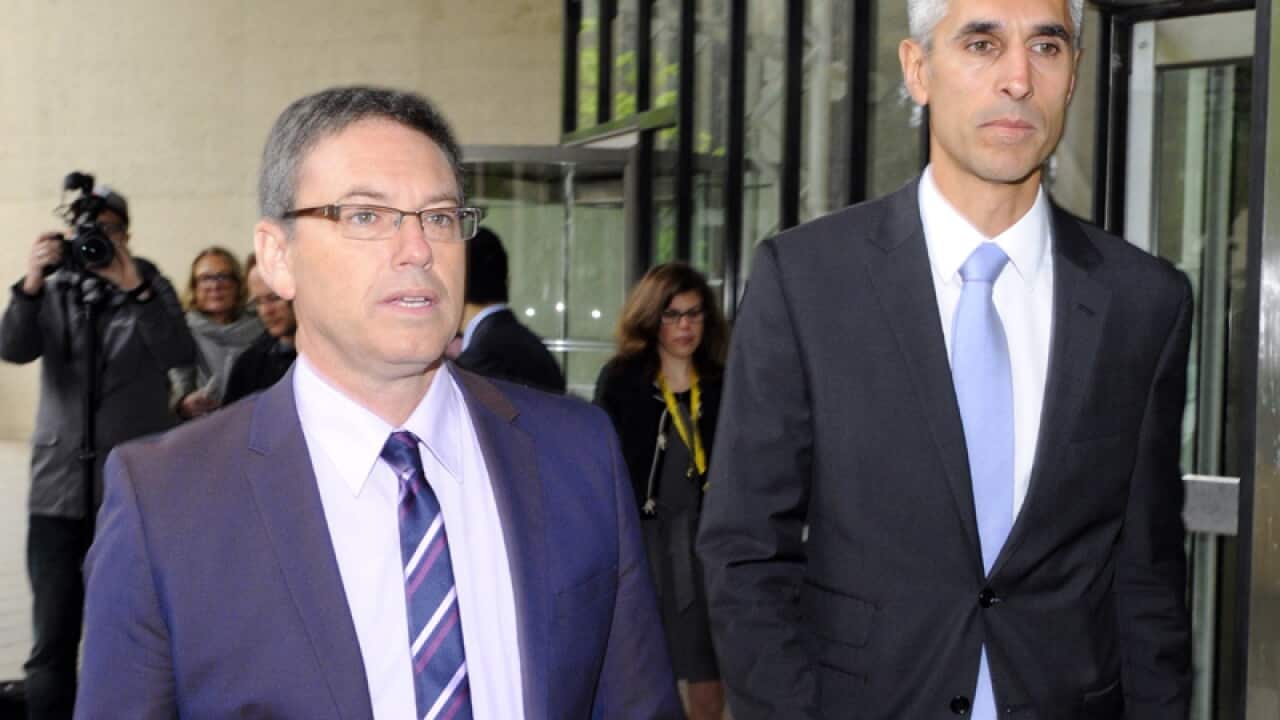 Human Rights Law Centre executive director Hugh de Kretser (R)
