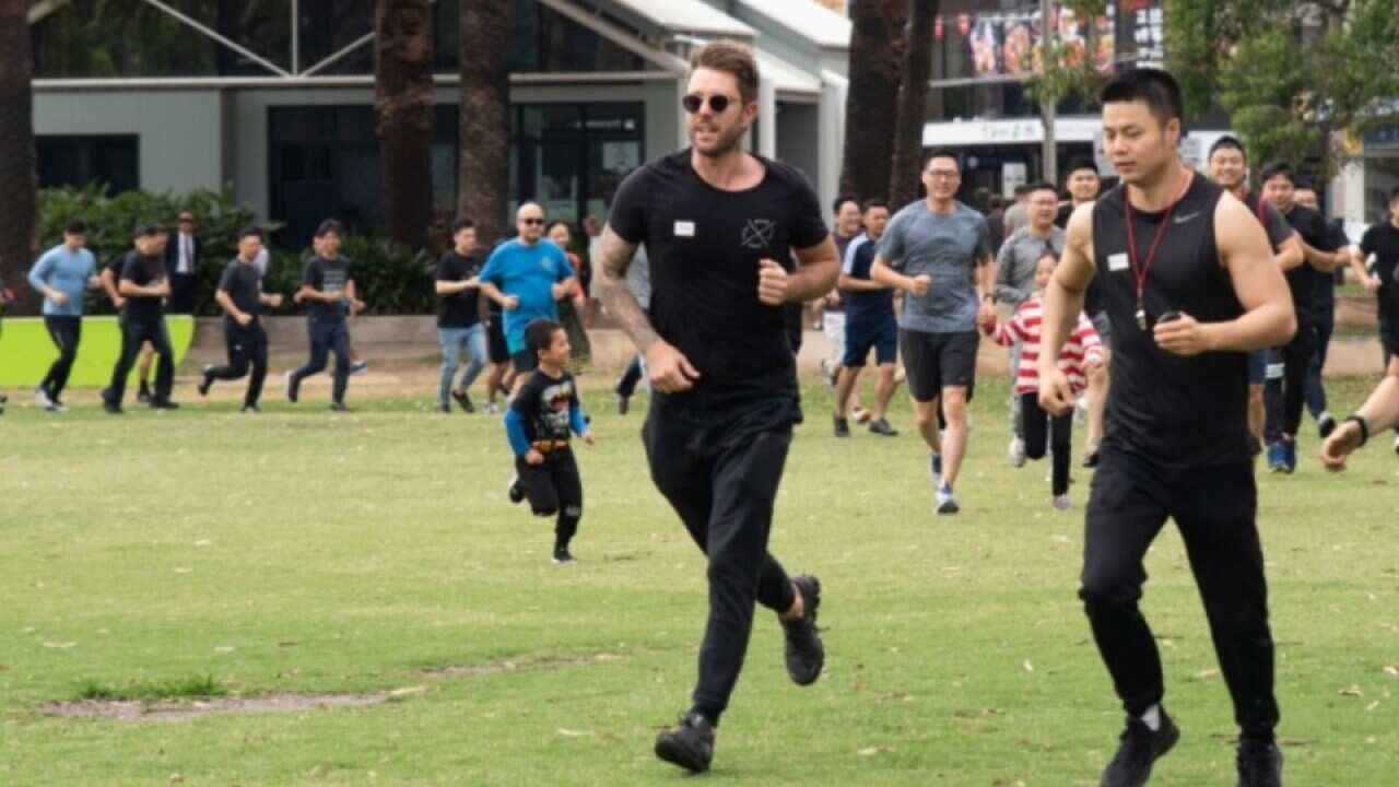 Andrew Xiang (first from right) in an activity to raise money for bushfire relief