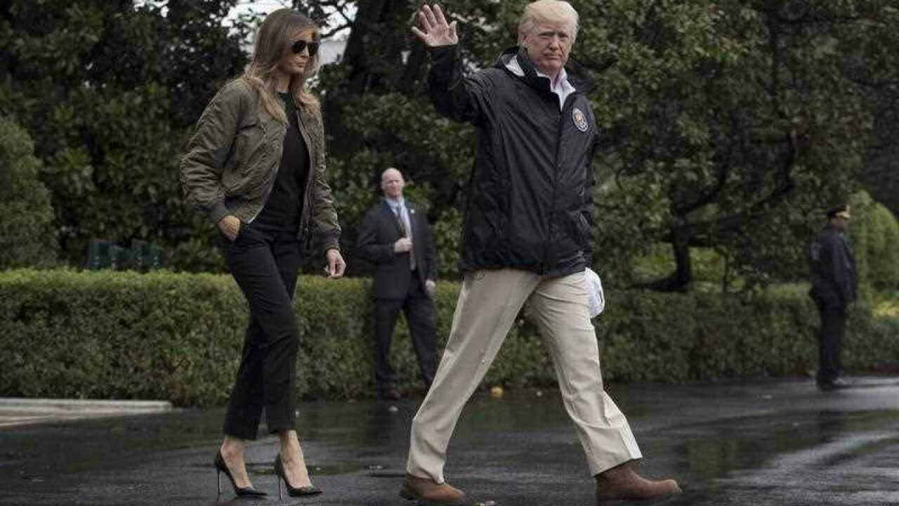 US President Donald J. Trump (R) and First Lady Melania Trump (L) walk out of the South Portico to depart the South Lawn of the White House by Marine One, in Washington, DC, USA, 29 August 2017.