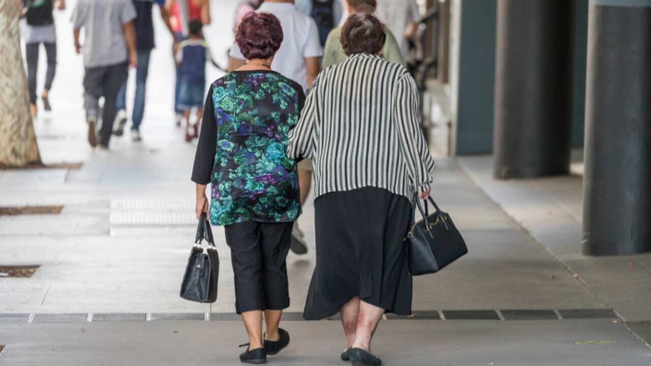 Elderly people walk in the street, in Brisbane, Saturday, May 5, 2018. (AAP Image/Glenn Hunt) NO ARCHIVING