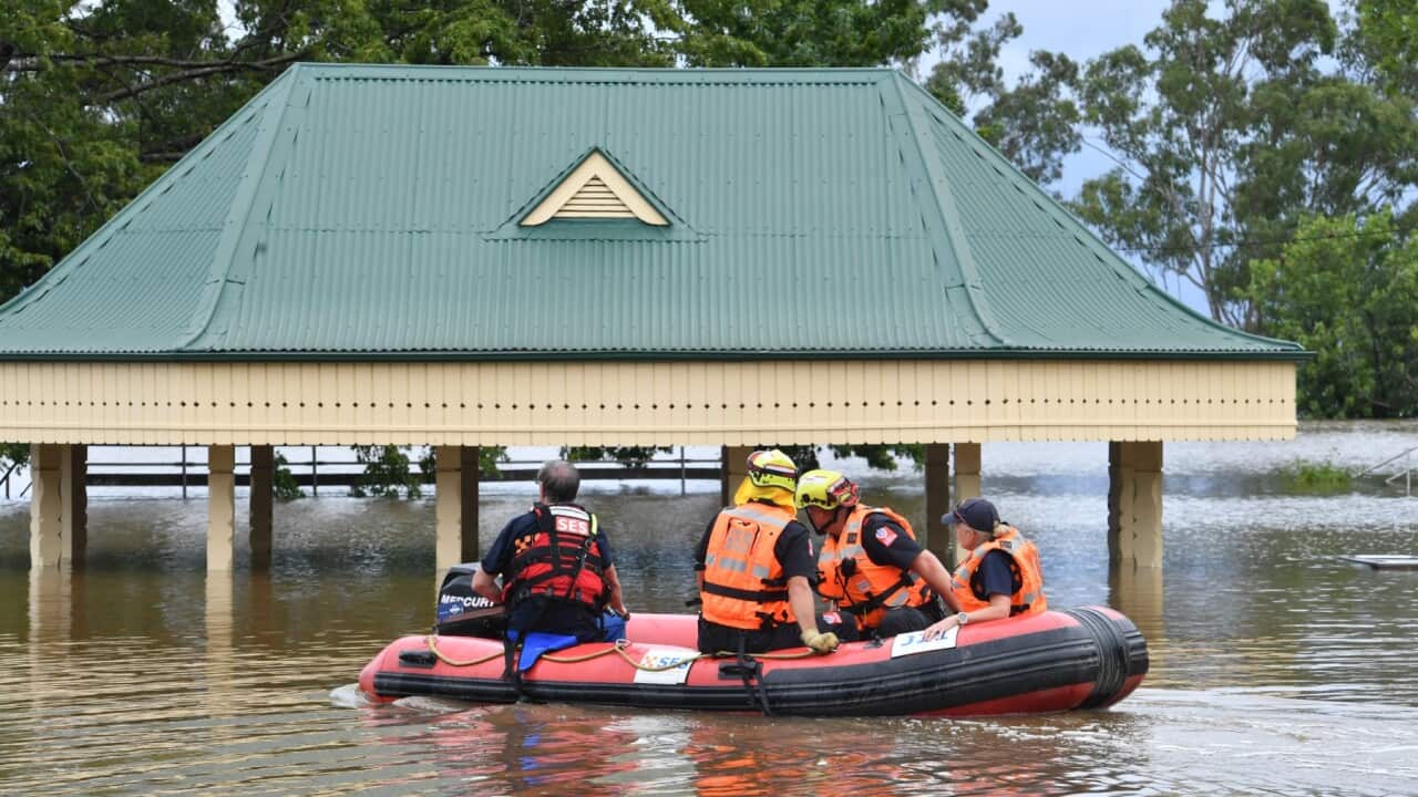 SES volunteers launch an inflatable rescue boat in Camden, South Western Sydney.