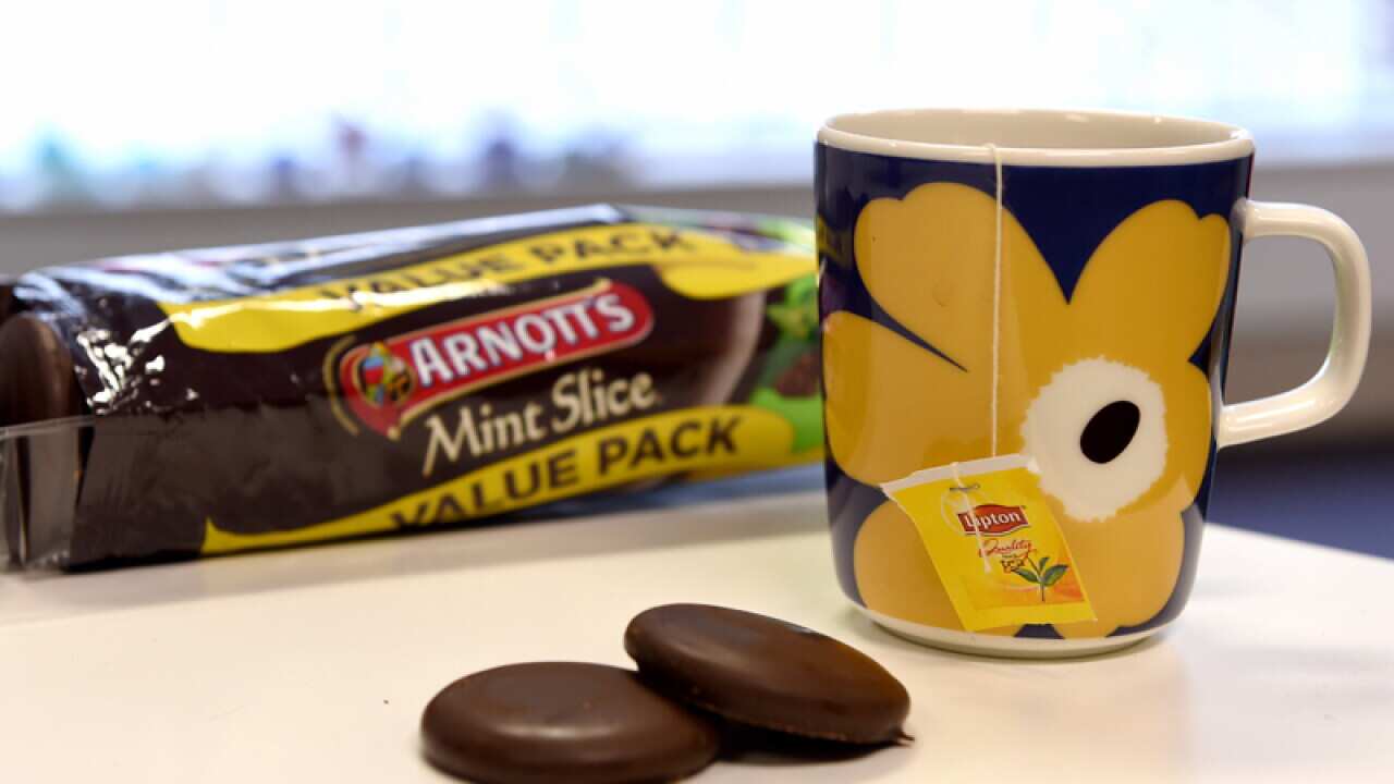 A cup of tea and Mint Slice biscuits