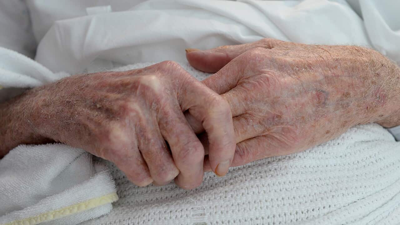 An elderly patient's hands