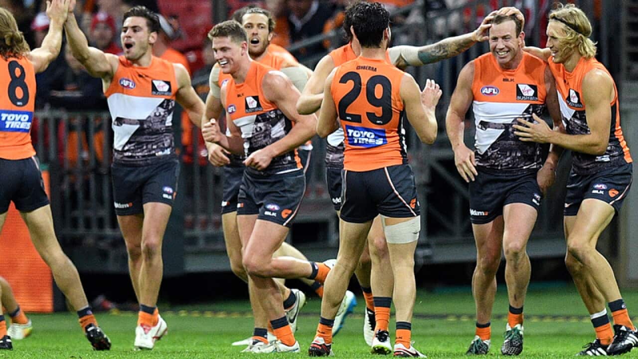 Steve Johnson of the Giants (second right) celebrates with team mates