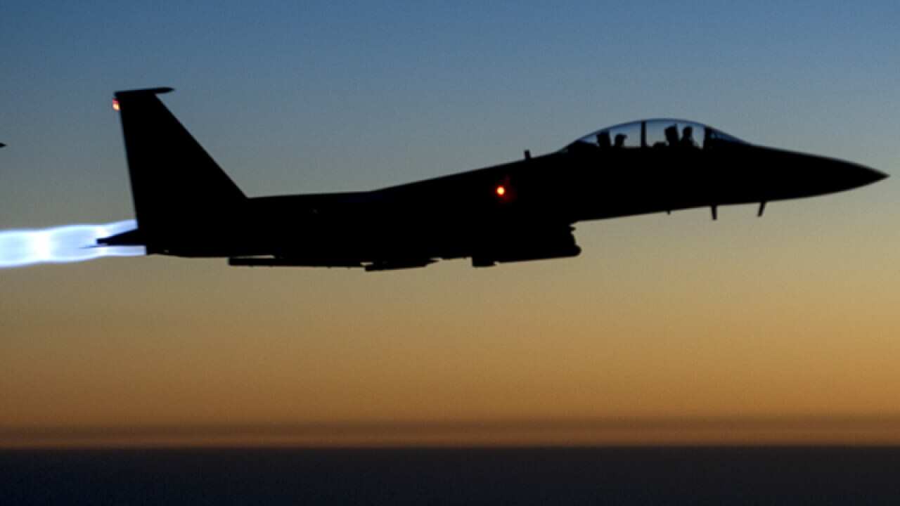 A pair of U.S. F-15E Strike Eagle fly over northern Iraq