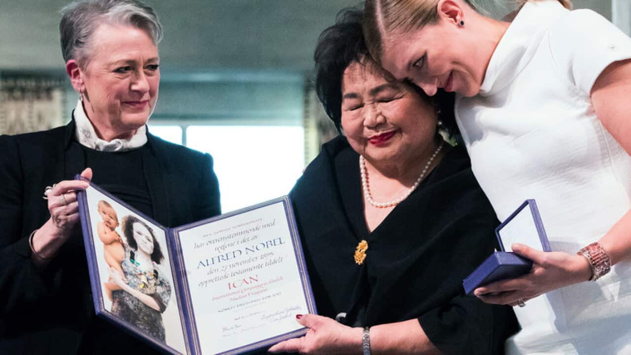 Leader of the Nobel committee Berit Reiss-Andersen presents the award to Hiroshima survivor Setsuko Thurlow and Beatrice Fihn