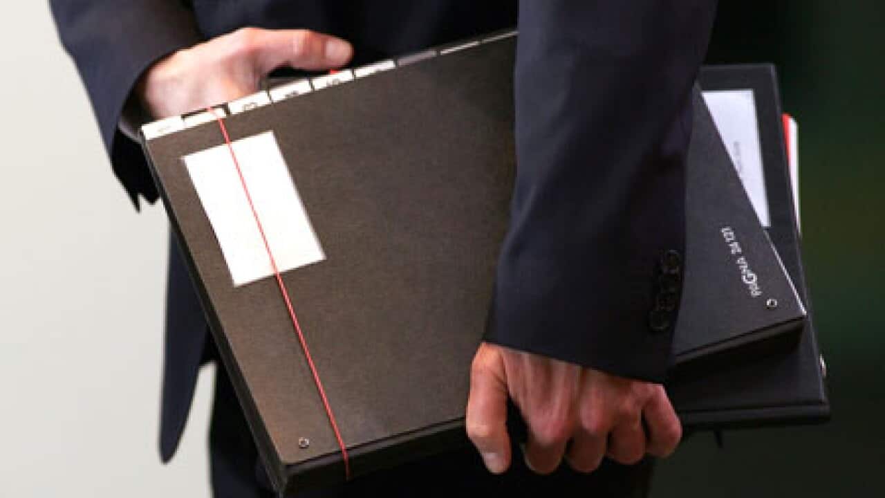 businessman_holding_files_090821_B_getty_1638104359