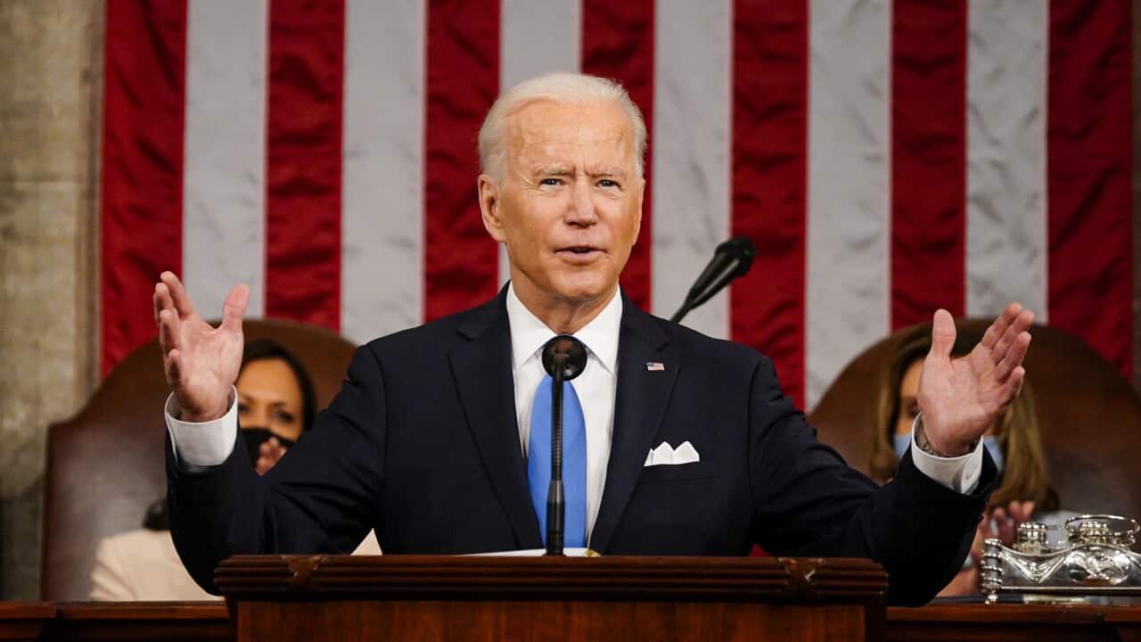 US President Joe Biden addresses a joint session of Congress, with Vice President Kamala Harris and House Speaker Nancy Pelosi behind him, on Wednesday.