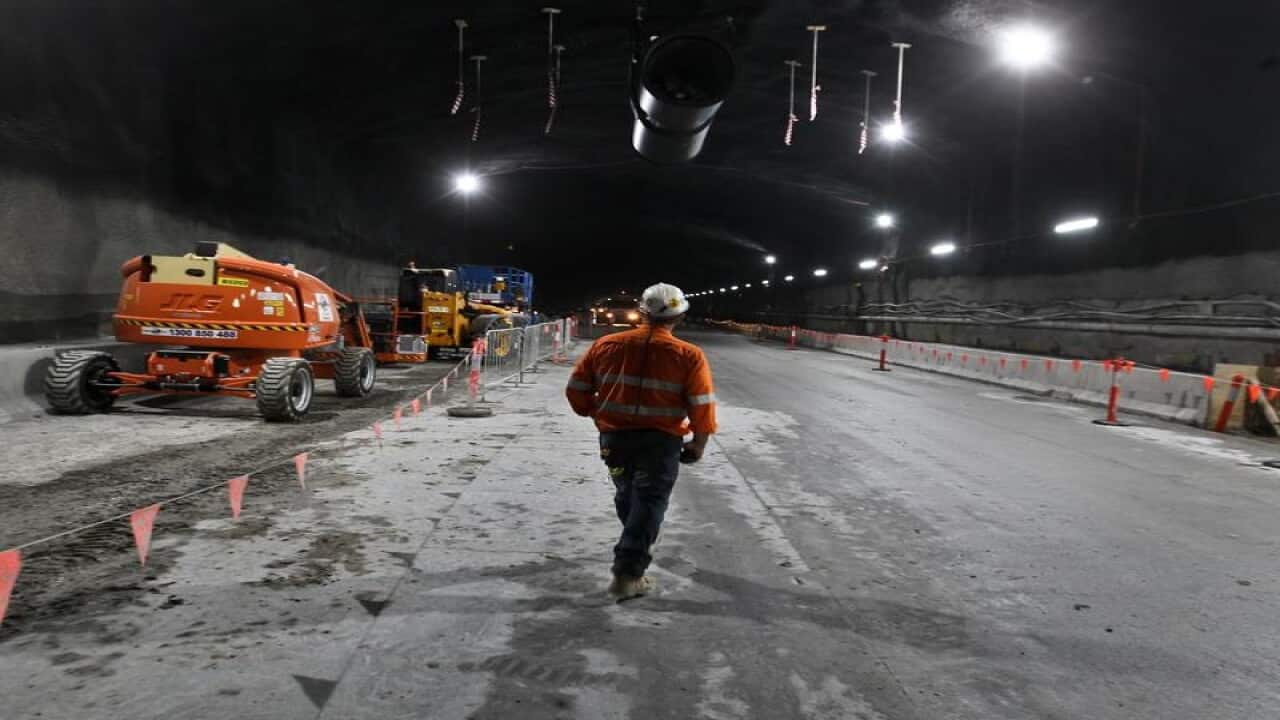 A construction worker in a Westconnex tunnel