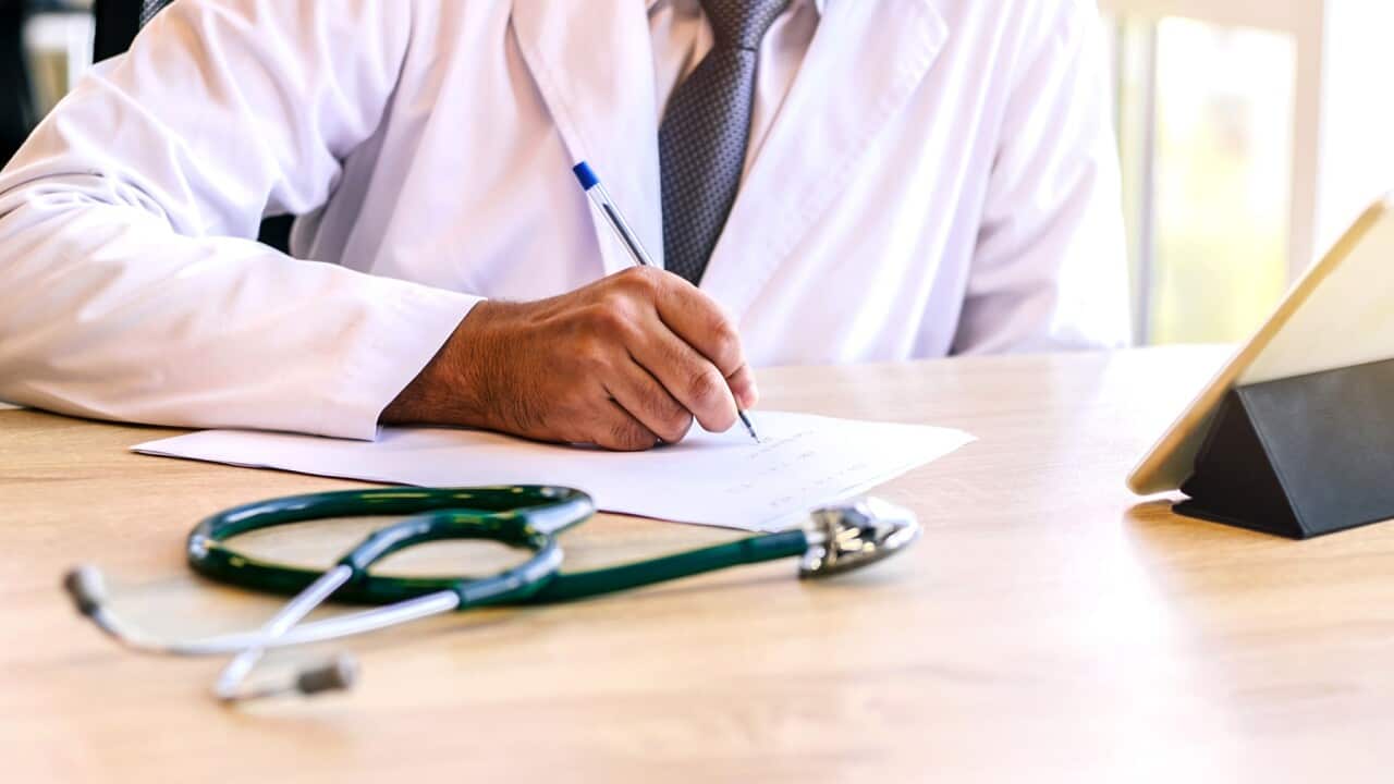 Doctor writing medical prescription.