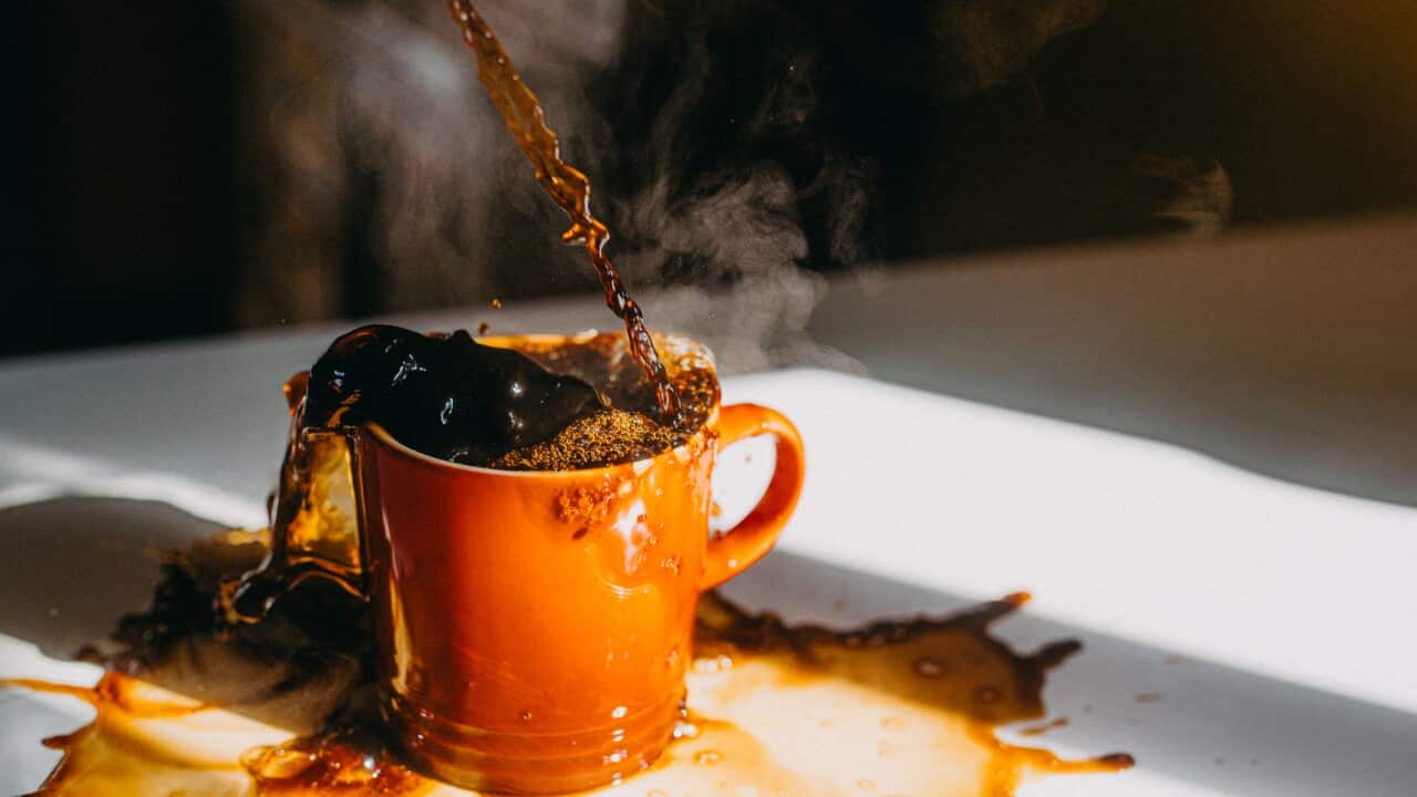 Overflowing Cup of Coffee