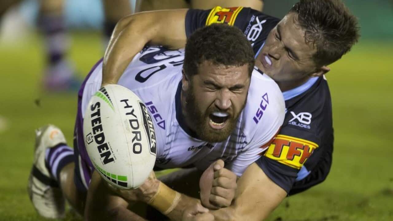Melbourne's Kenneath Bromwich is tackled