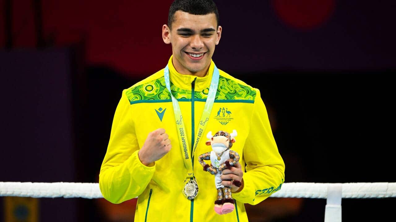 Callum Peters on the podium with a silver medal