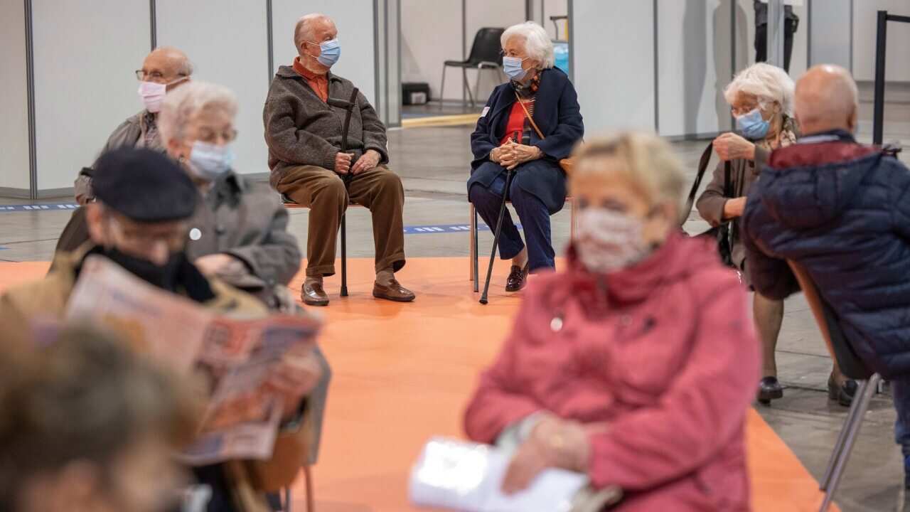 Belgium's King Albert II and Queen Paola (at rear) are among the seniors getting vaccinated in Brussels