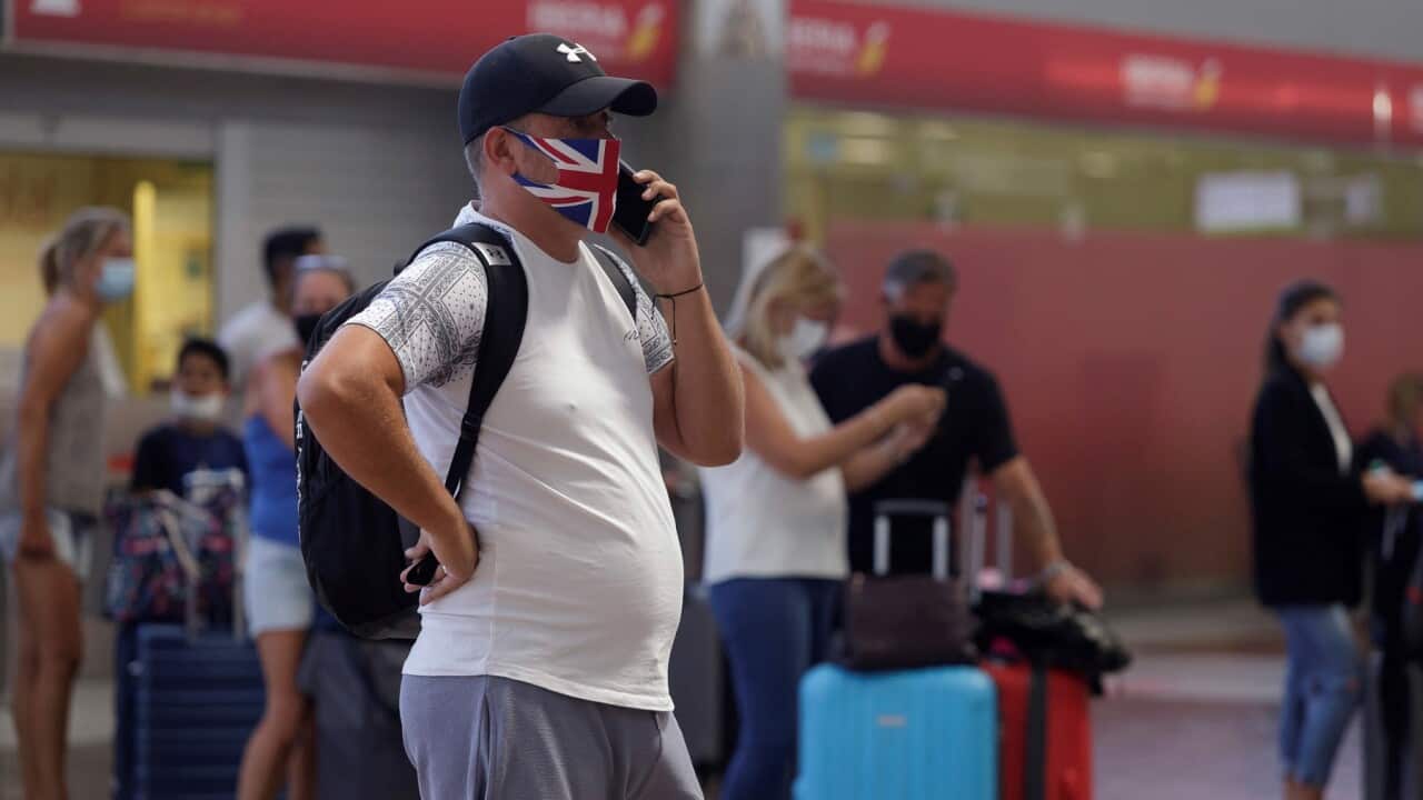 A British tourist checks in before departing for UK at Tenerife, Spain