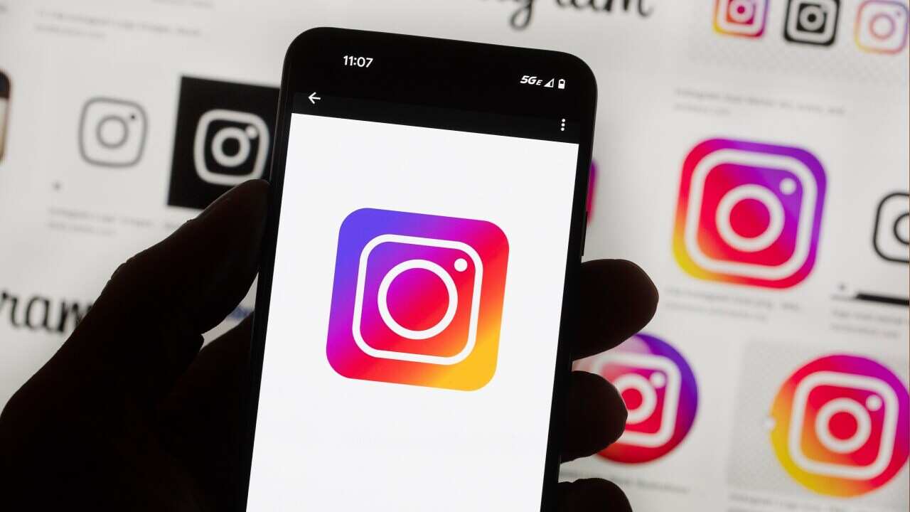 FILE - The Instagram logo is seen on a cell phone in Boston, Oct. 14, 2022. (AP Photo/Michael Dwyer, File)