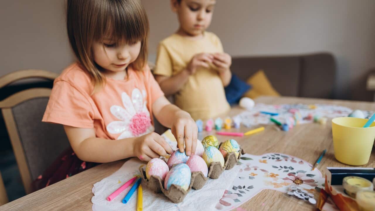 Children decorating Easter eggs together