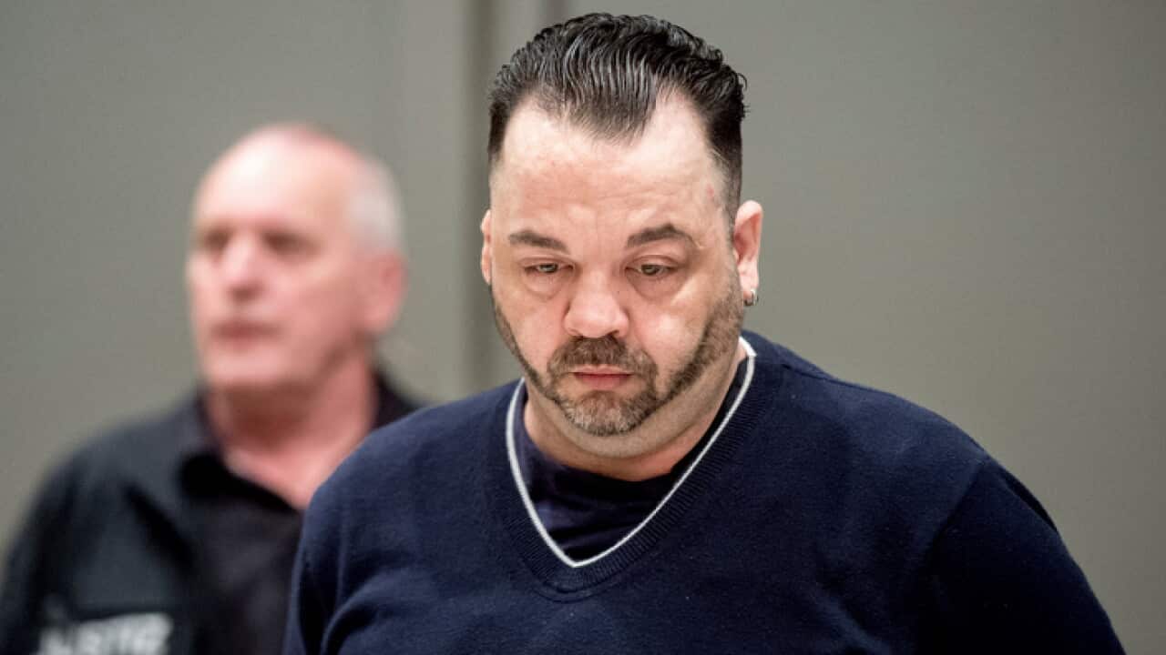 Former nurse Niels Hoegel, right, accused of multiple murder and attempted murder of patients, arrives for a session of the district court in Oldenburg, Germany, Thursday, June 6, 2019. (Hauke-Christian Dittrich/dpa via AP)