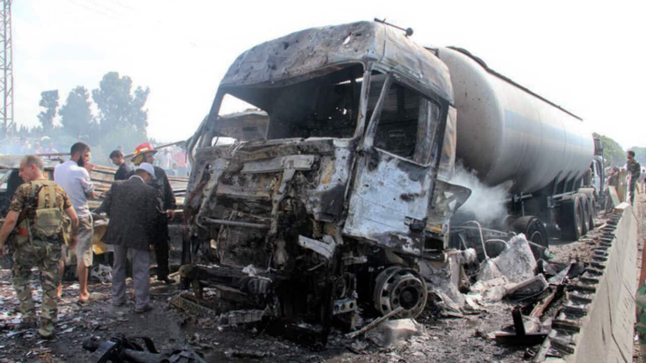 The burnt-out remains of vehicles in Tartus