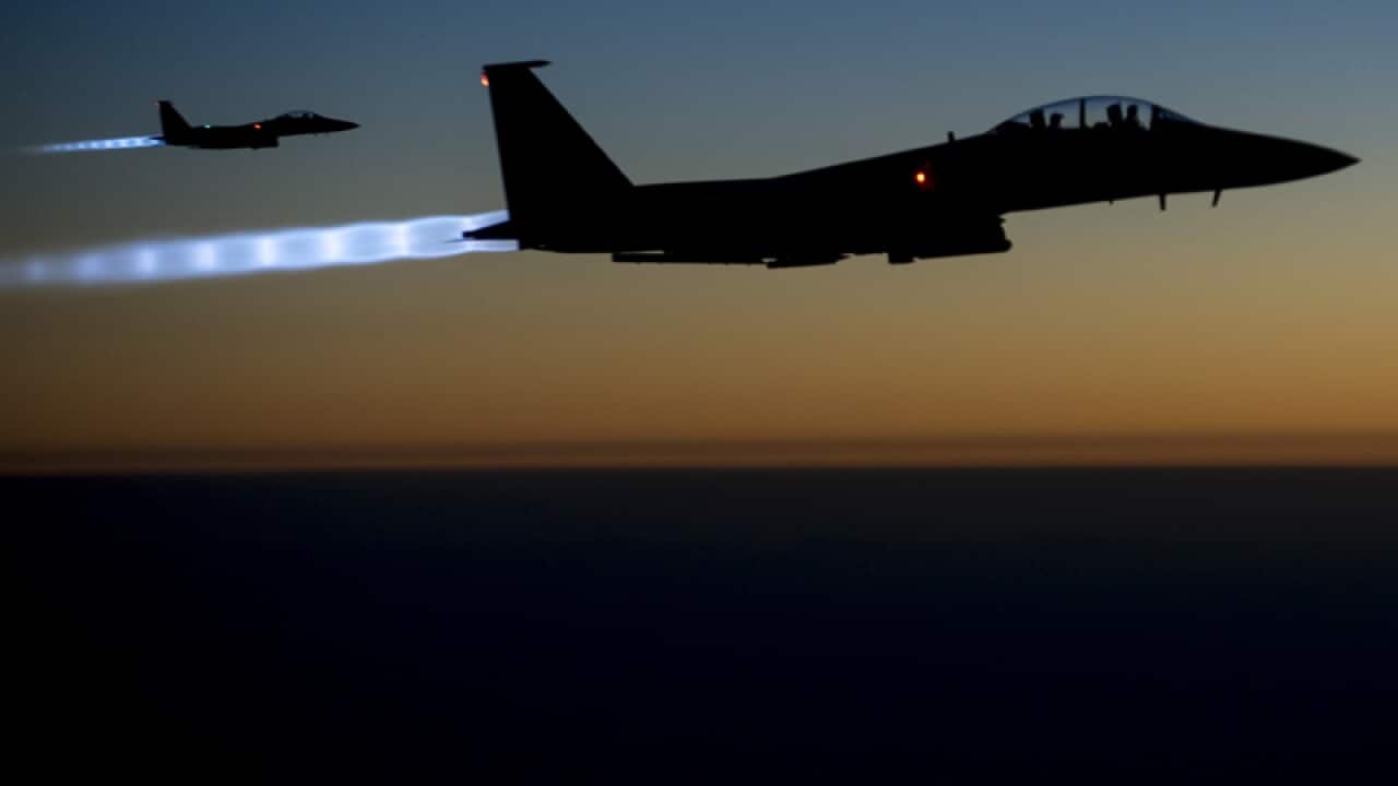 A pair of U.S. F-15E Strike Eagle flies over northern Iraq