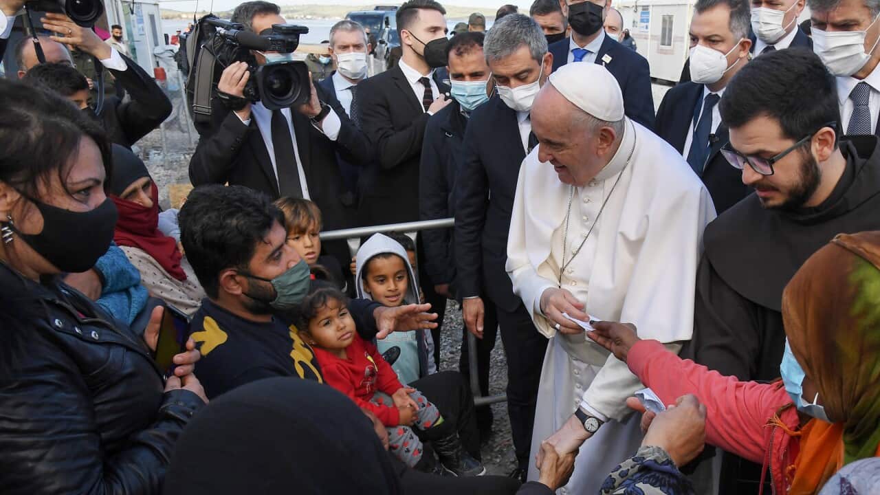 Pope Francis talks to people at the Reception and Identification Centre (RIC) in Mytilene on the island of Lesbos, Greece, 5 December 2021.