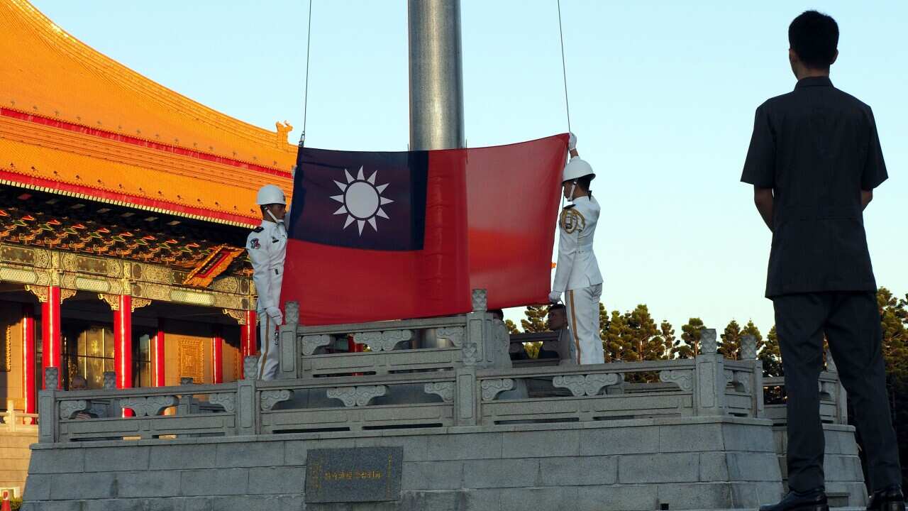 Soldiers perform the flag-raising ceremony at the Liberty Square in Taipei, Taiwan. 