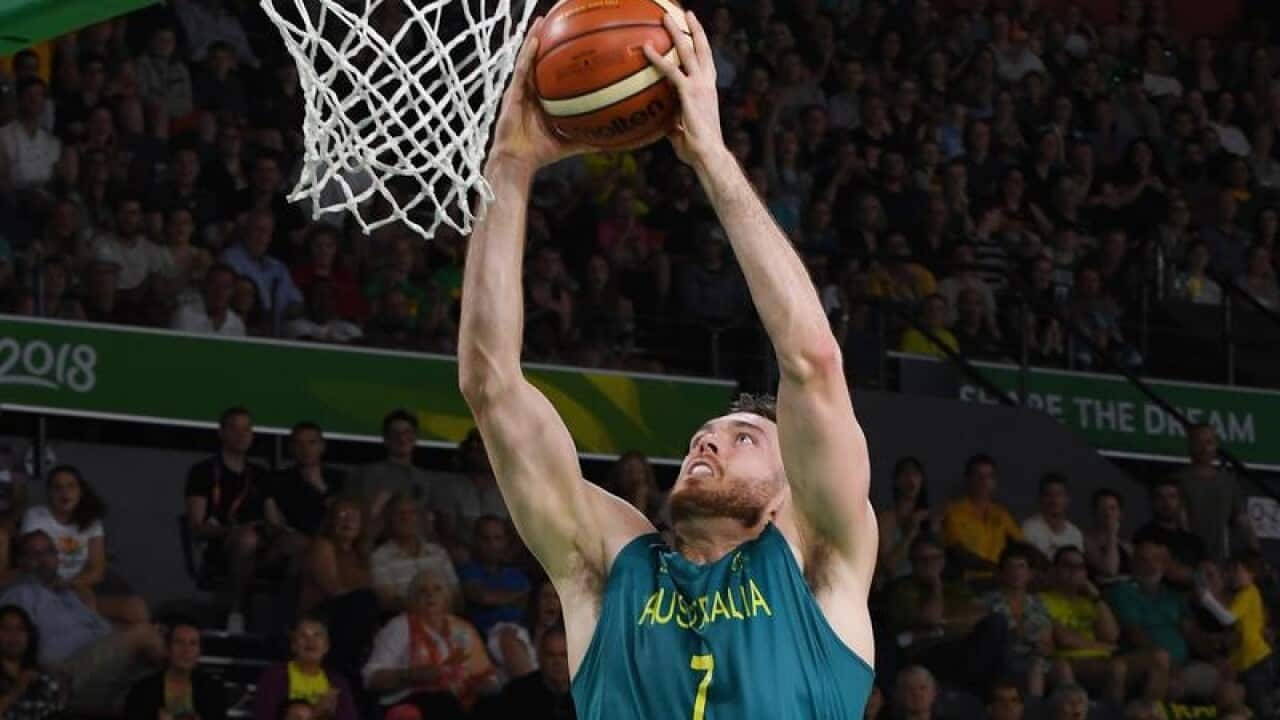 Australia's Nicholas Kay slam dunks.