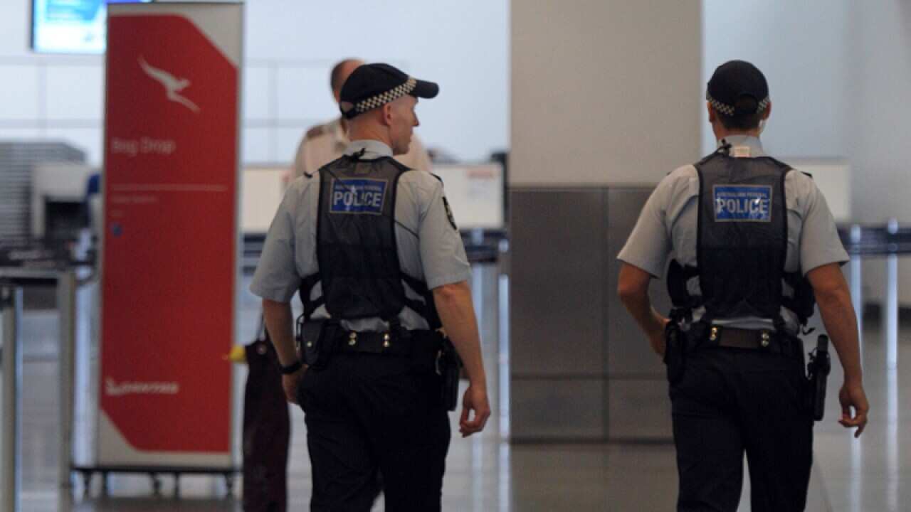 Federal police patrol Melbourne Airport in Melbourne